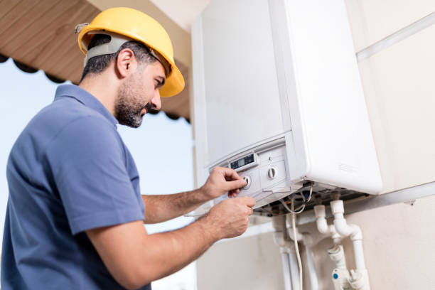 Boiler technician working in home.